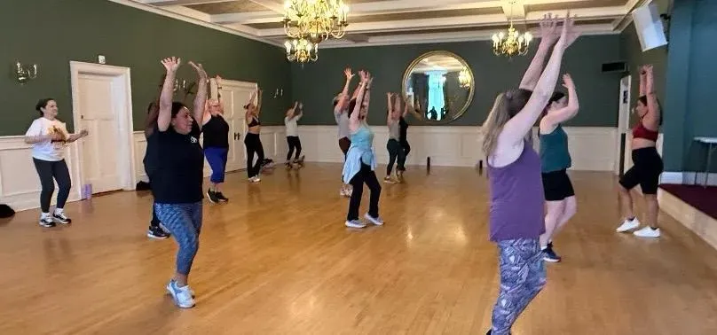 A morning class in full swing, seen from the back of the hall